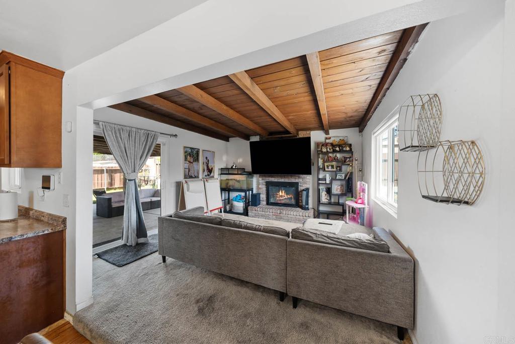 565 June Way El Cajon, CA 92021 - Photo 3 of 42 a living room with furniture and a flat screen tv