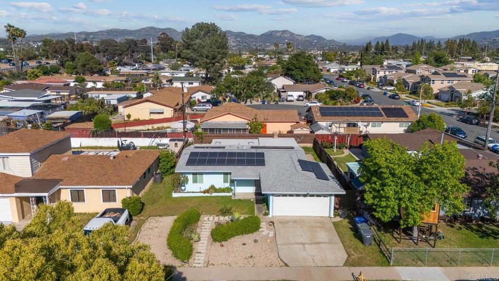 565 June Way El Cajon, CA 92021 - Photo 31 of 42 an aerial view of residential houses with outdoor space and trees