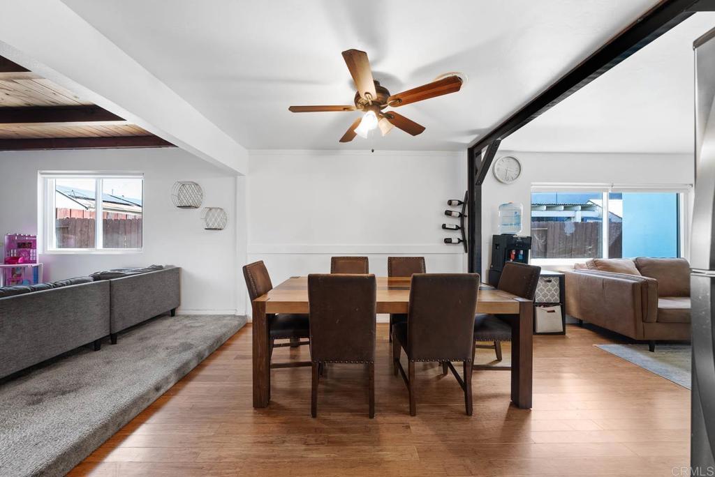 565 June Way El Cajon, CA 92021 - Photo 4 of 42 a view of a dining room with furniture window and wooden floor