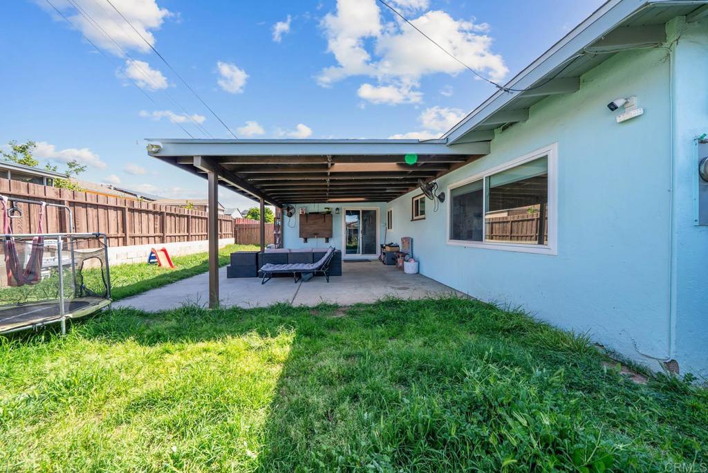 565 June Way El Cajon, CA 92021 - Photo 42 of 42 a view of a porch with chairs and backyard