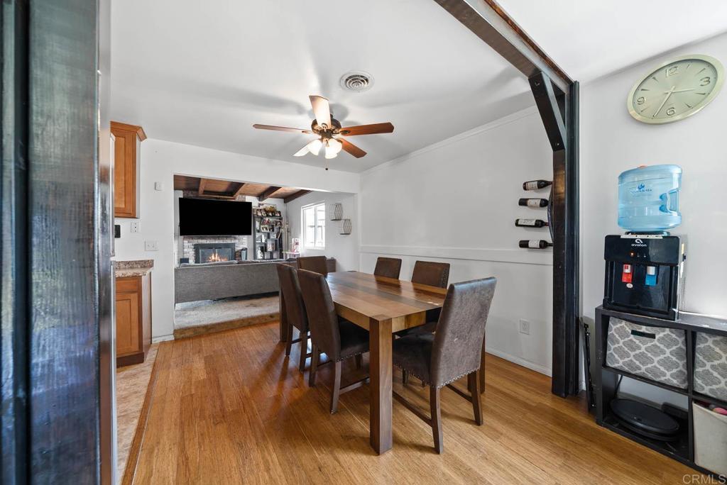 565 June Way El Cajon, CA 92021 - Photo 7 of 42 a view of a dining room with furniture and wooden floor