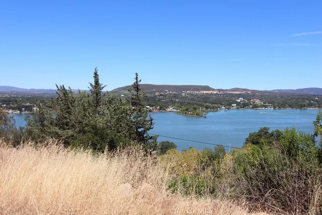 a view of a lake with houses in the back