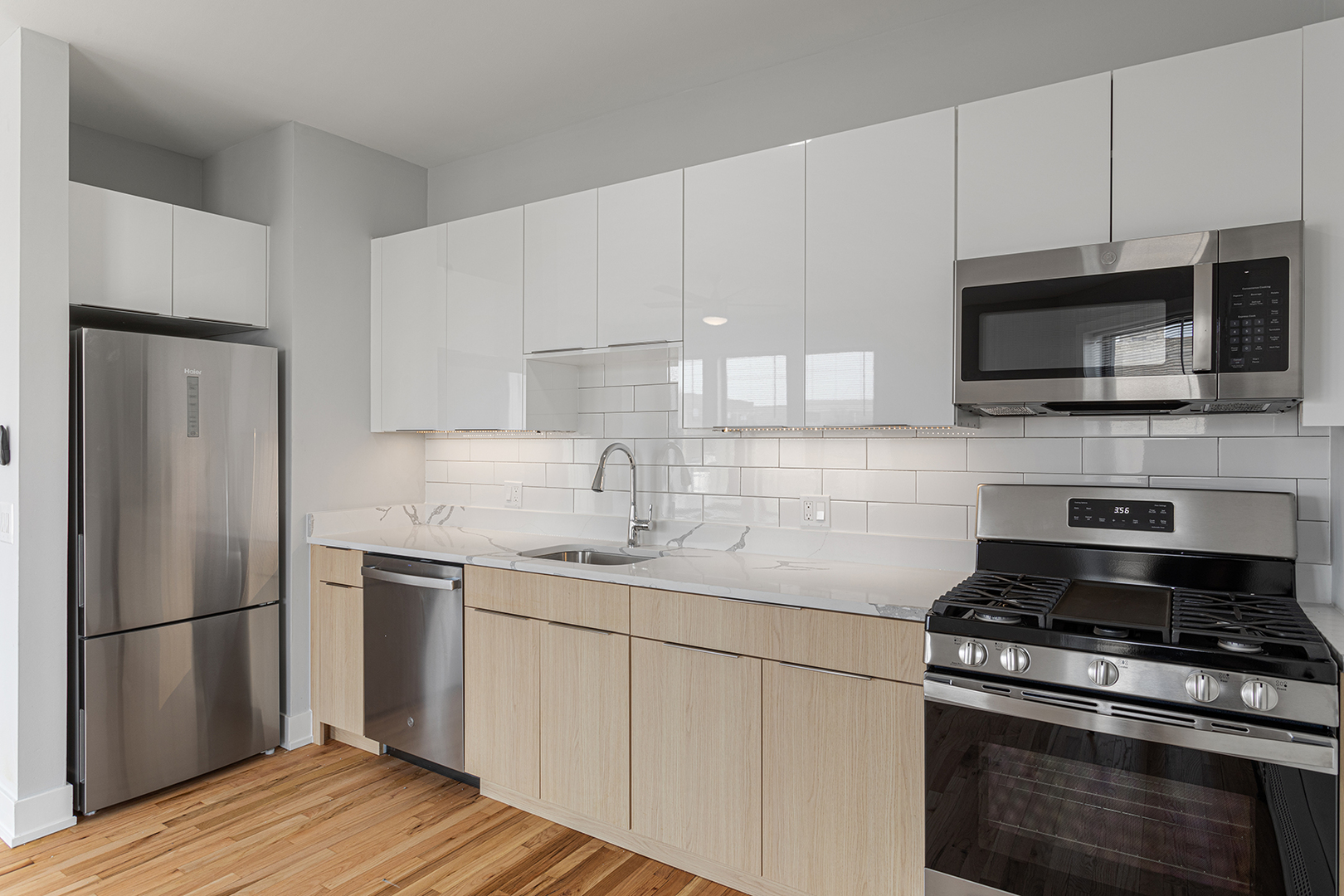 1625 West Howard Street, Unit 219 Chicago, IL 60626 - Photo 2 of 10 a kitchen with a sink stove and refrigerator