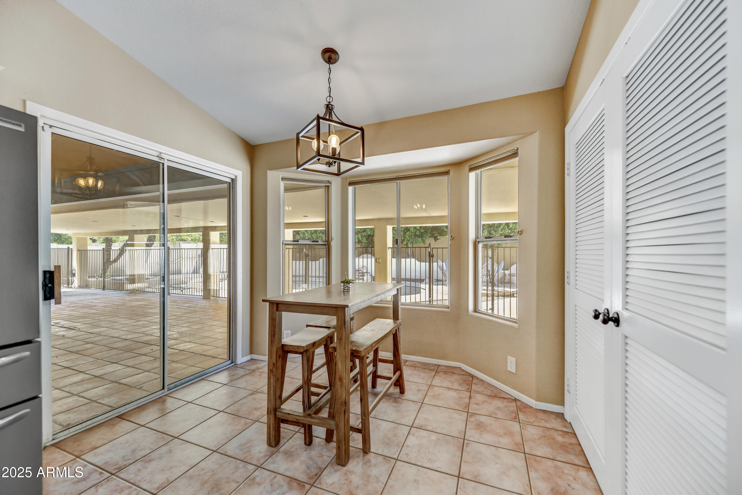 2015 East Bendix Drive Tempe, AZ 85283 - Photo 11 of 31 a view of a livingroom with furniture wooden floor and a chandelier