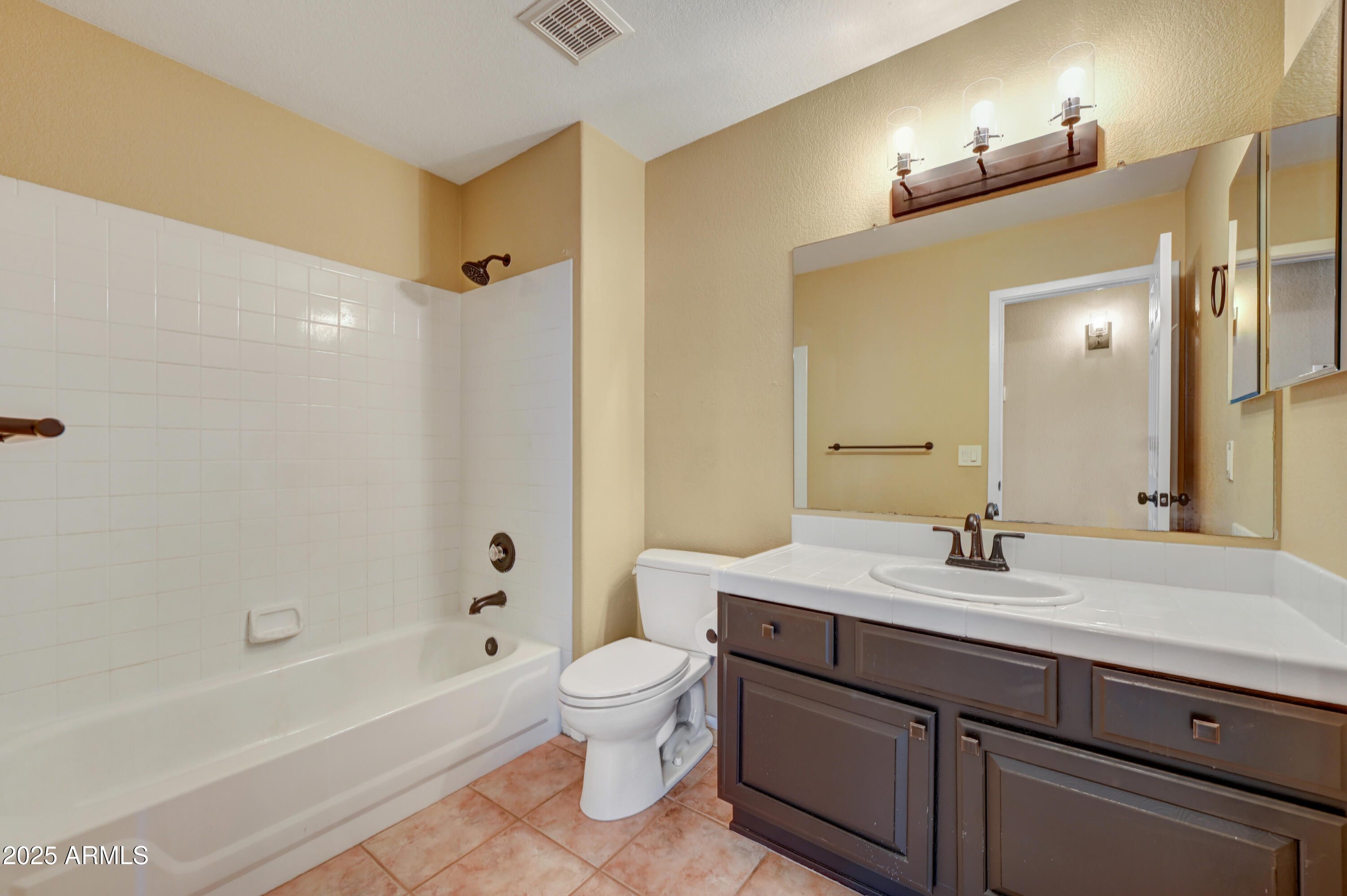 2015 East Bendix Drive Tempe, AZ 85283 - Photo 18 of 31 a bathroom with a sink a toilet and shower