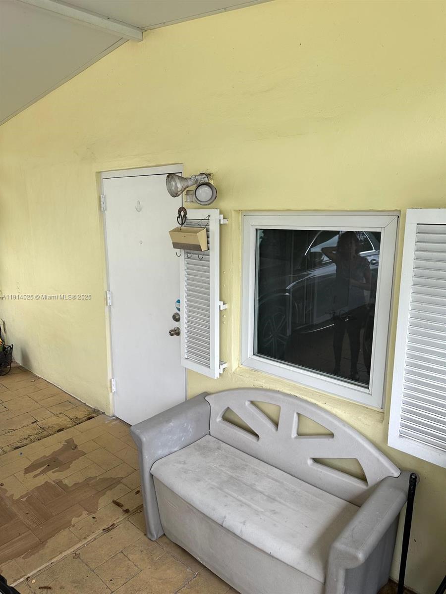 9101 Southwest 88th Street, Unit 1 Miami, FL 33173 - Photo 2 of 10 a bedroom with a bed and a dresser