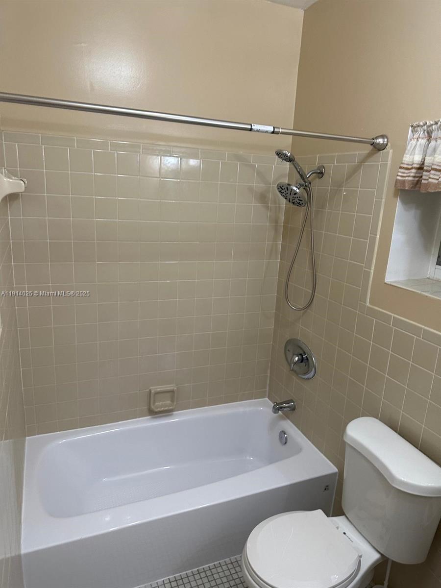 9101 Southwest 88th Street, Unit 1 Miami, FL 33173 - Photo 10 of 10 a bathroom with a toilet bathtub and shower