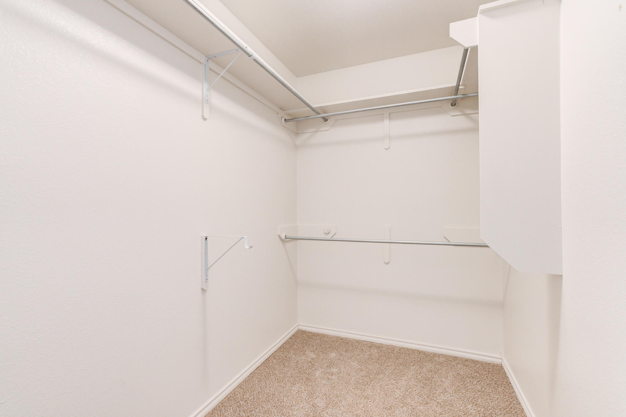 7518 87th Street Lubbock, TX 79424 - Photo 31 of 36 a view of walk in closet with racks