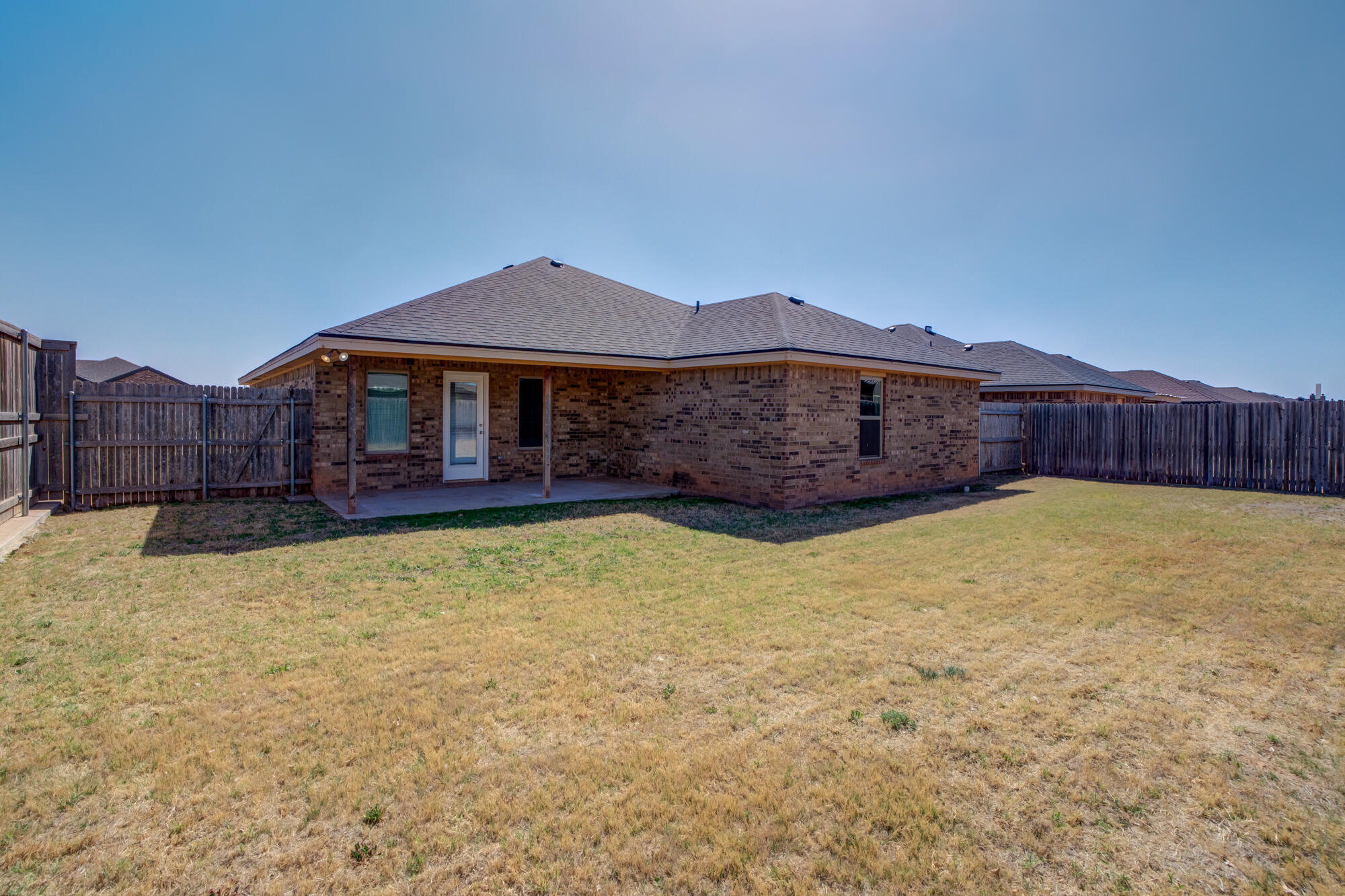 7518 87th Street Lubbock, TX 79424 - Photo 36 of 36 a front view of a house with swimming pool