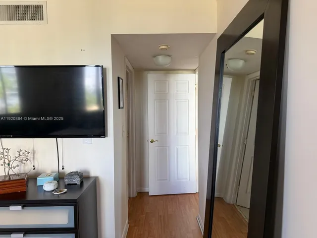 a view of a living room with a flat screen tv