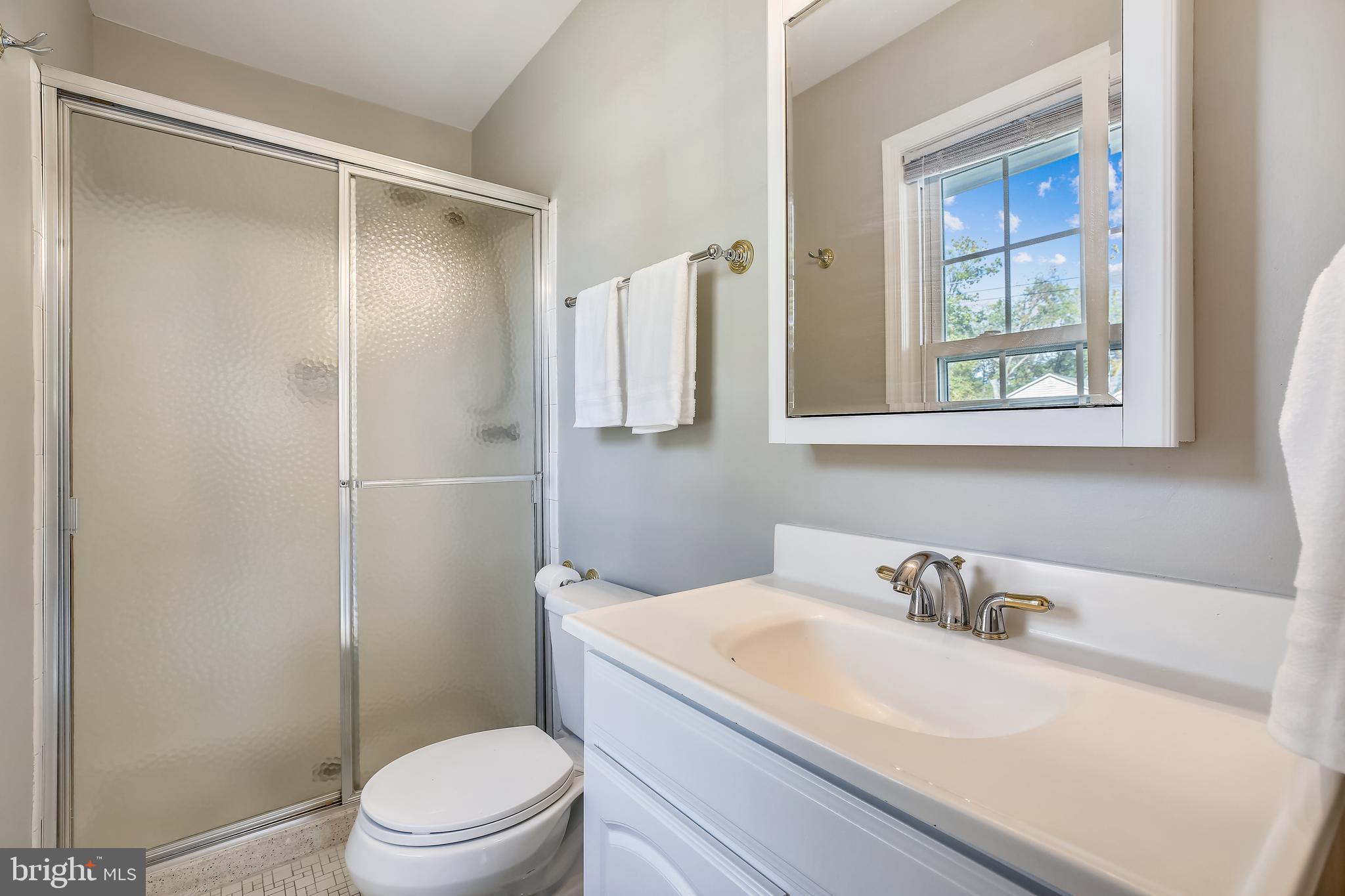 1593 Kimblewick Road Potomac, MD 20854 - Photo 24 of 45 a bathroom with a sink toilet and shower
