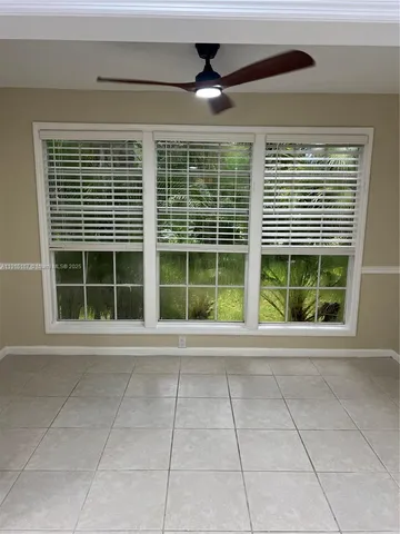 a view of empty room with windows