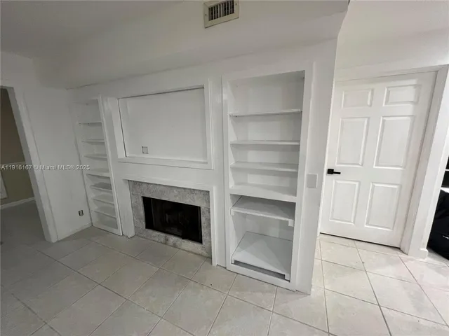 a bathroom with a sink mirror vanity and toilet