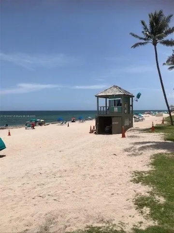 a view of a chair and table in the garden
