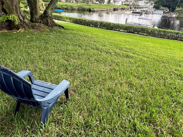 a view of a room with wooden floor and stairs