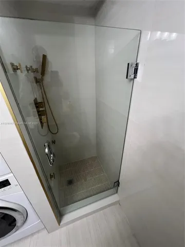 a bathroom with a sink vanity and mirror
