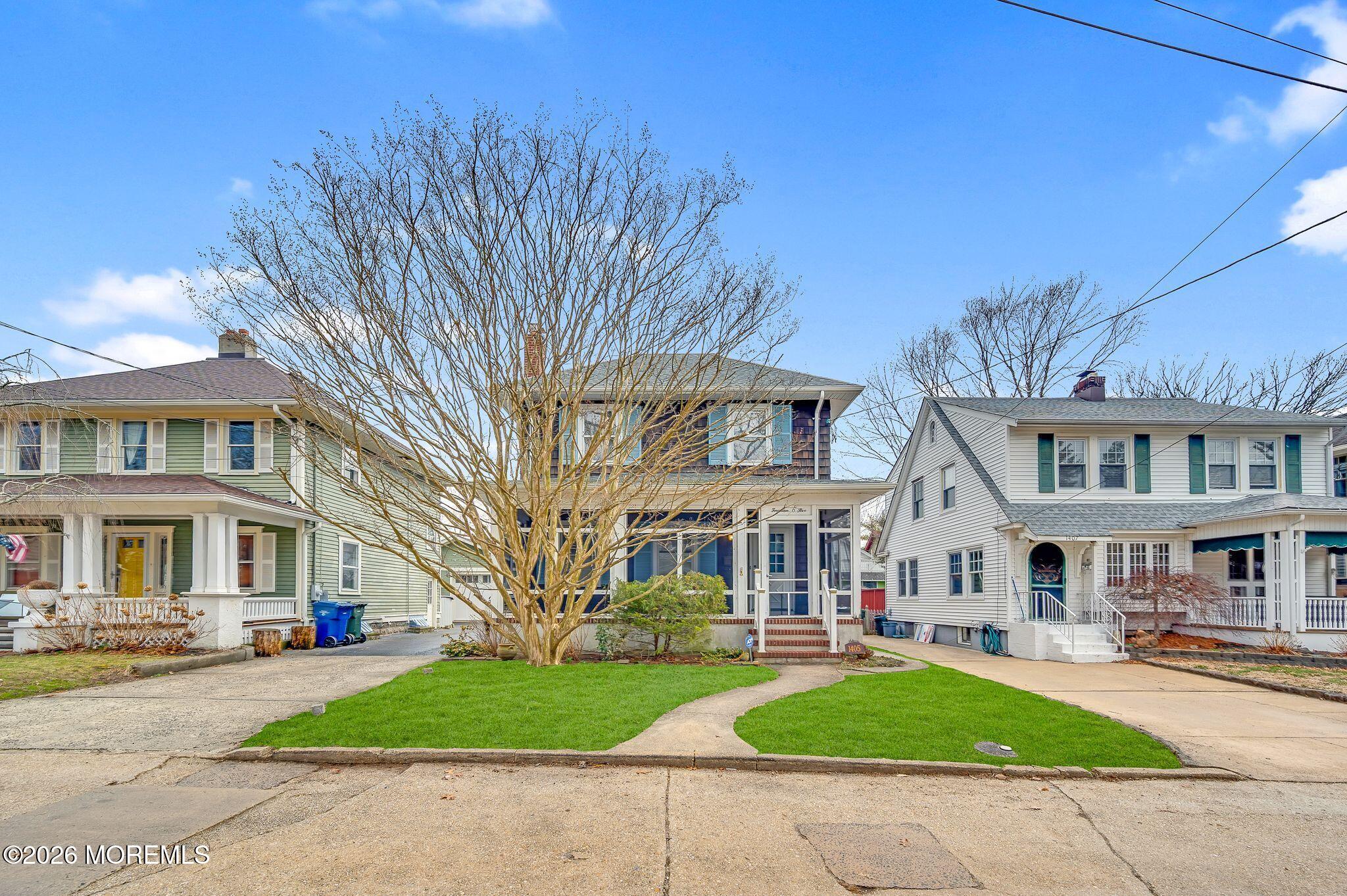 1405 Wanamassa Road Asbury Park, NJ 07712 - Photo 2 of 42 a front view of residential houses with yard and green space
