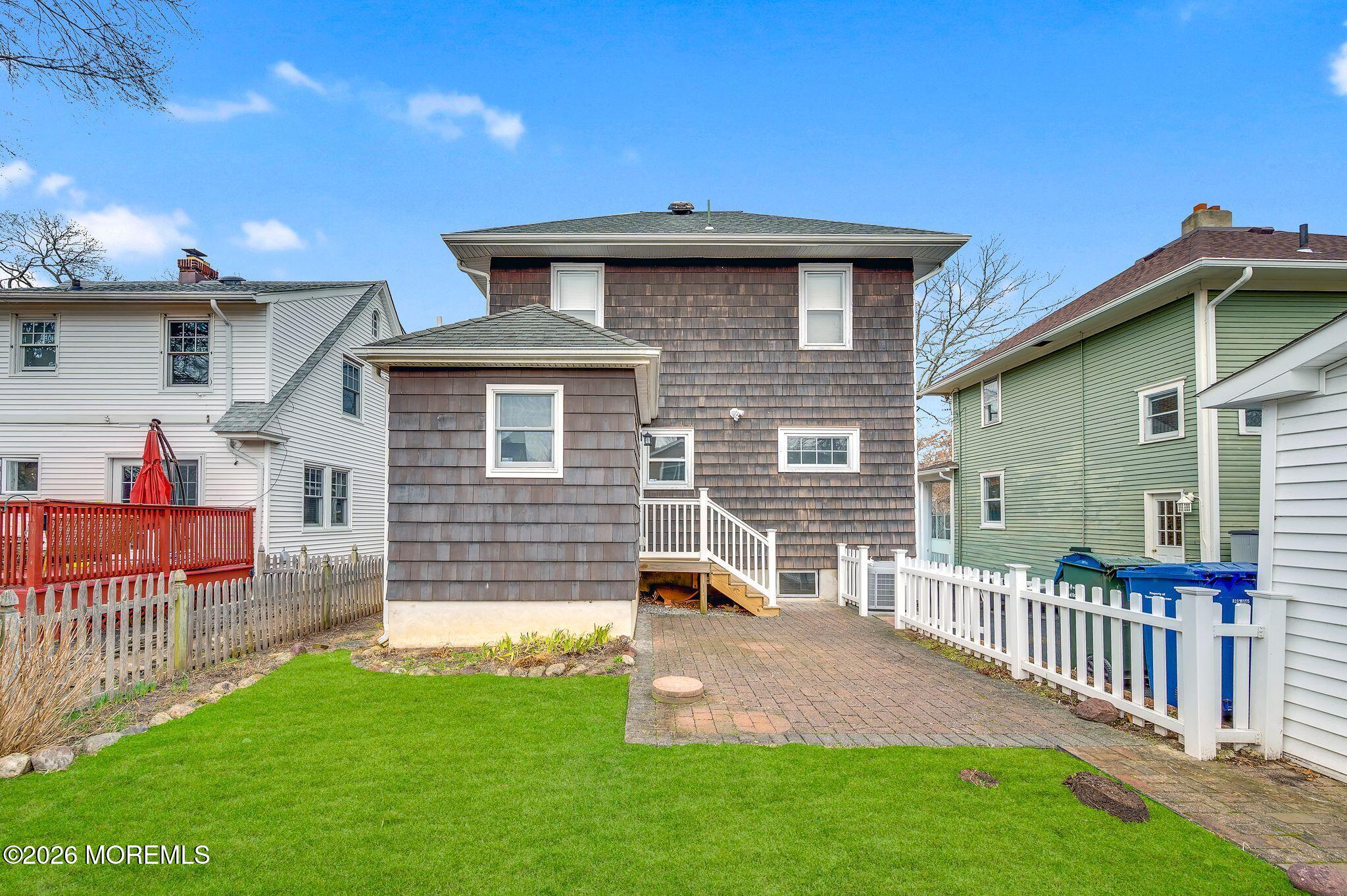 1405 Wanamassa Road Asbury Park, NJ 07712 - Photo 29 of 42 a front view of a house with a yard
