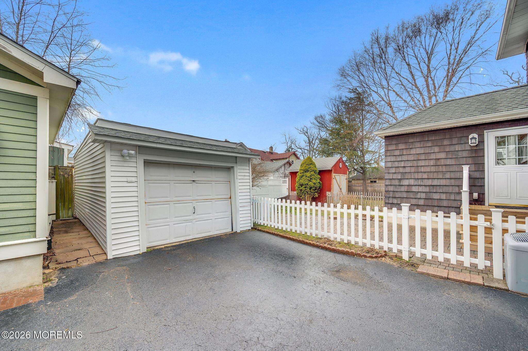 1405 Wanamassa Road Asbury Park, NJ 07712 - Photo 30 of 42 a view of a house with a garage