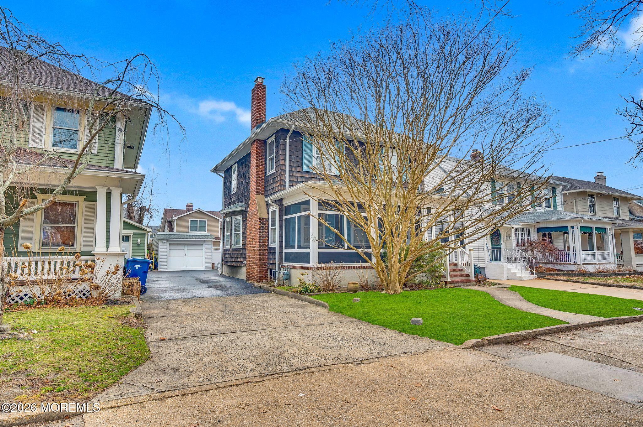 1405 Wanamassa Road Asbury Park, NJ 07712 - Photo 4 of 42 a front view of a house with a yard