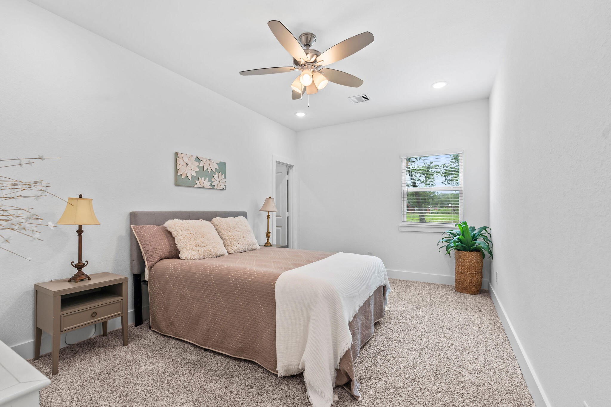 39645 Bosque Road Hempstead, TX 77445 - Photo 24 of 37 a bedroom with a bed and a chandelier