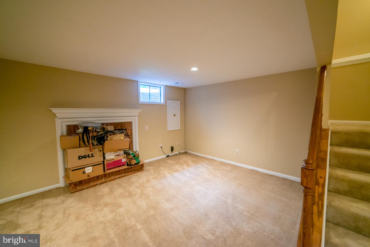 202 Finale Terrace Silver Spring, MD 20901 - Photo 7 of 12 Spacious basement family room & hidden fire place