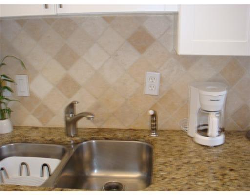 1405 Bridgewood Drive, Unit 1405 Boca Raton, FL 33434 - Photo 14 of 45 a bathroom with a sink and a window