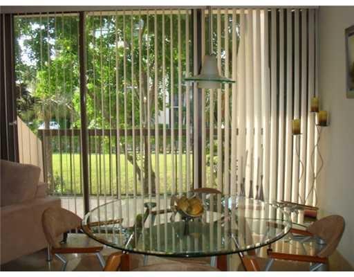 1405 Bridgewood Drive, Unit 1405 Boca Raton, FL 33434 - Photo 17 of 45 a view of a balcony with floor to ceiling windows
