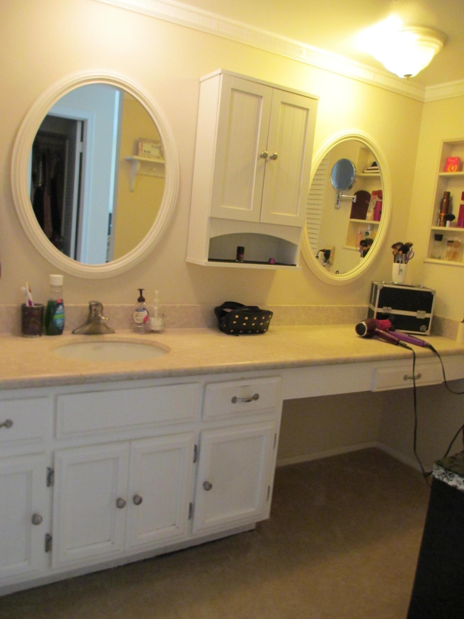 1405 Bridgewood Drive, Unit 1405 Boca Raton, FL 33434 - Photo 27 of 54 a bathroom with a sink and a mirror