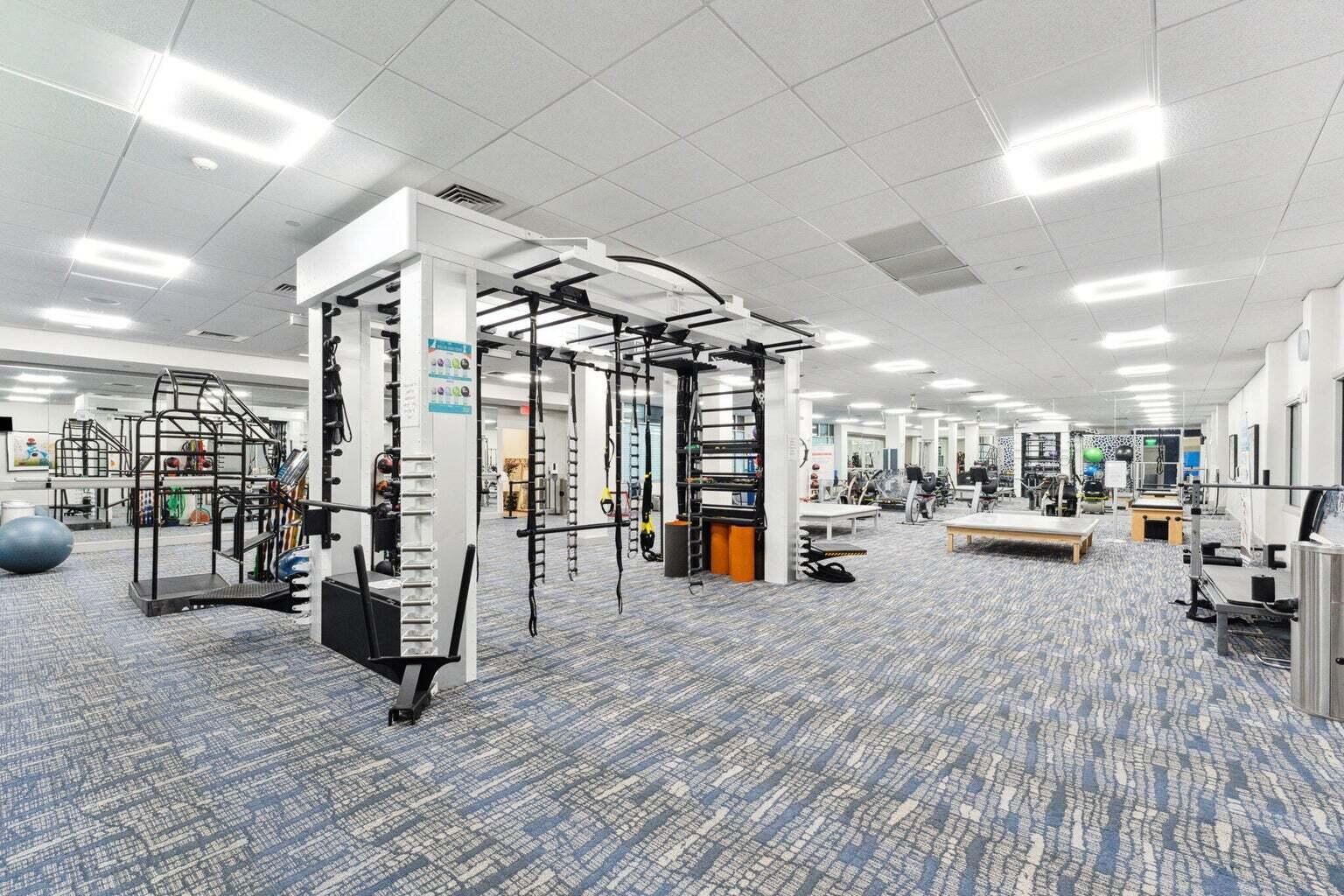 1405 Bridgewood Drive, Unit 1405 Boca Raton, FL 33434 - Photo 45 of 45 a view of a room with gym equipment