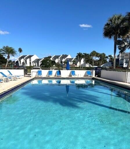 1405 Bridgewood Drive, Unit 1405 Boca Raton, FL 33434 - Photo 5 of 54 a view of a lake with houses