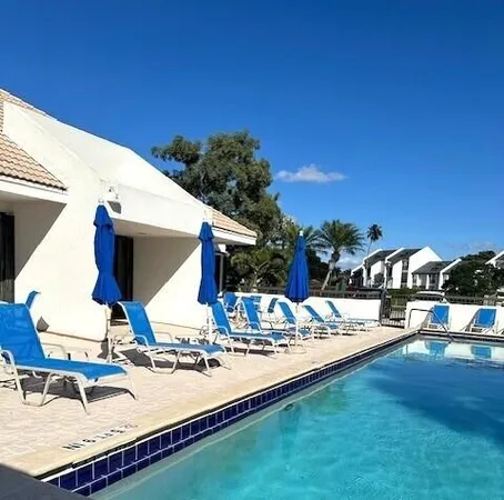 a view of swimming pool with outdoor seating