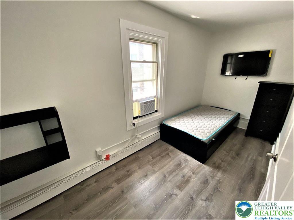 517 Thomas Street Bethlehem, PA 18015 - Photo 21 of 30 a living room with furniture and a flat screen tv