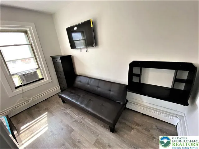 a living room with furniture and a window