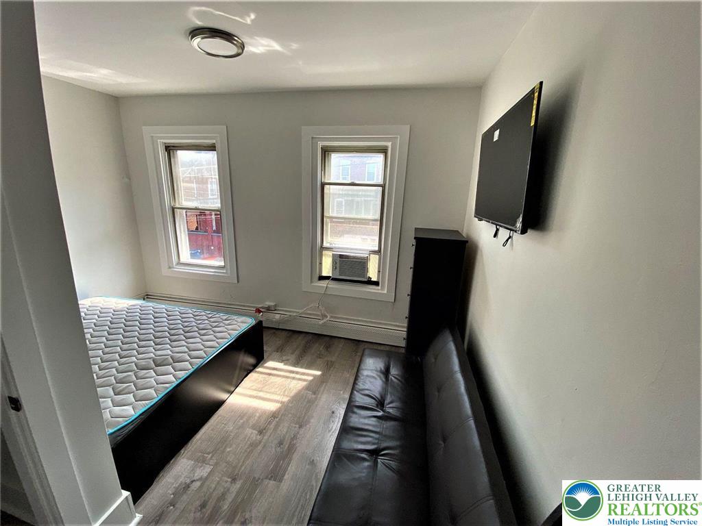 517 Thomas Street Bethlehem, PA 18015 - Photo 24 of 30 a view of an empty room with wooden floor and a window