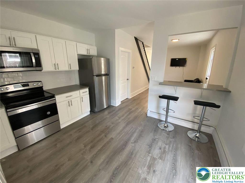 517 Thomas Street Bethlehem, PA 18015 - Photo 4 of 30 a view of kitchen with sink microwave and refrigerator