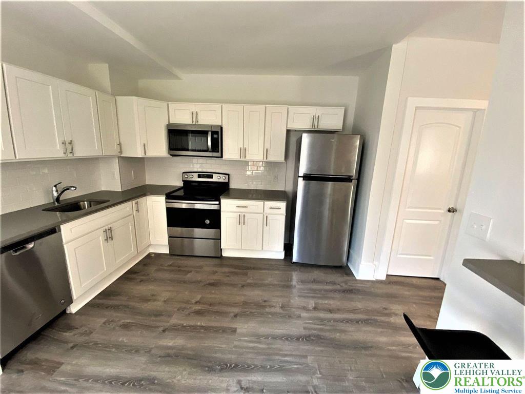 517 Thomas Street Bethlehem, PA 18015 - Photo 6 of 30 a kitchen with a refrigerator and a sink