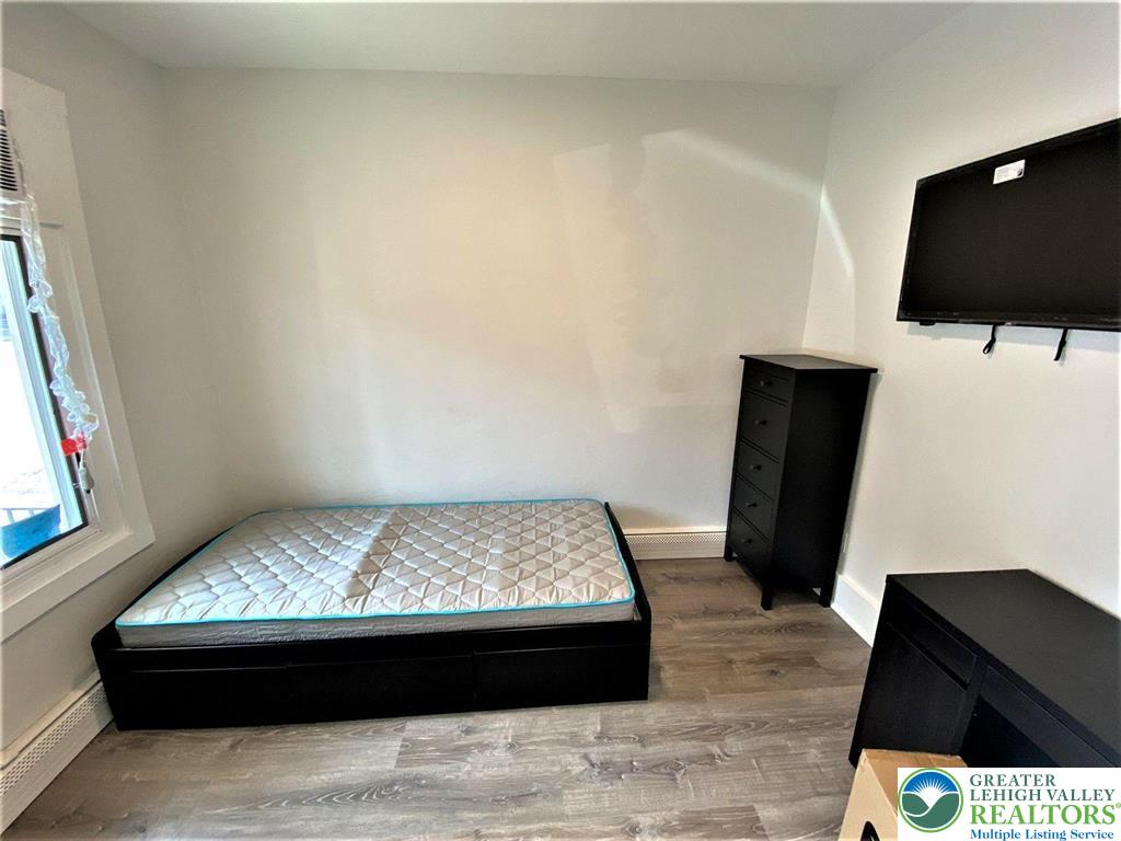517 Thomas Street Bethlehem, PA 18015 - Photo 10 of 30 a room with a bed and a flat screen tv