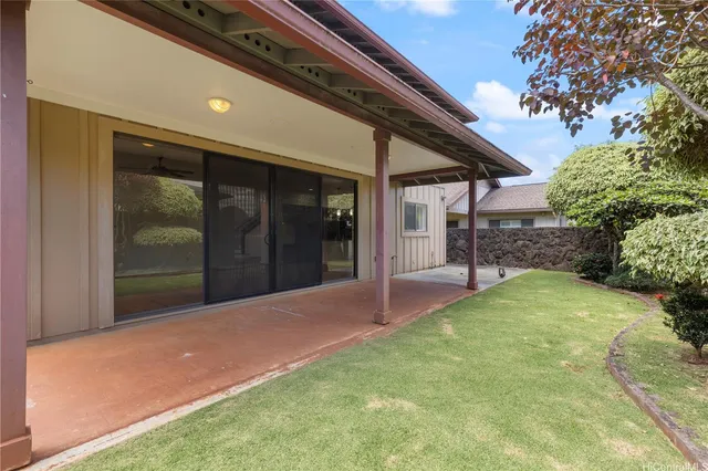 a view of a backyard of the house