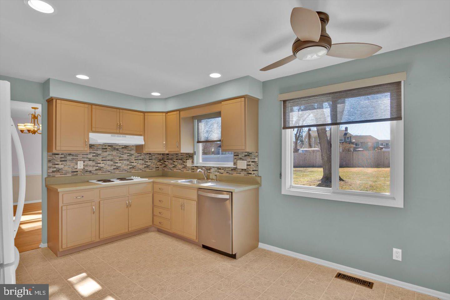 104 Lamp Post Lane Cherry Hill, NJ 08003 - Photo 14 of 44 a kitchen with stainless steel appliances granite countertop a stove a sink and a refrigerator