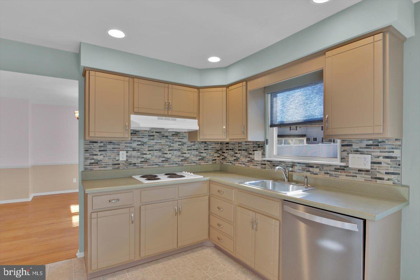 104 Lamp Post Lane Cherry Hill, NJ 08003 - Photo 17 of 44 a kitchen with a sink stove and cabinets