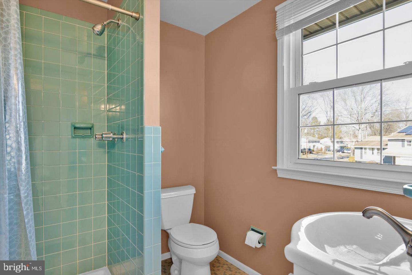 104 Lamp Post Lane Cherry Hill, NJ 08003 - Photo 27 of 44 a bathroom with a toilet a sink a window and shower