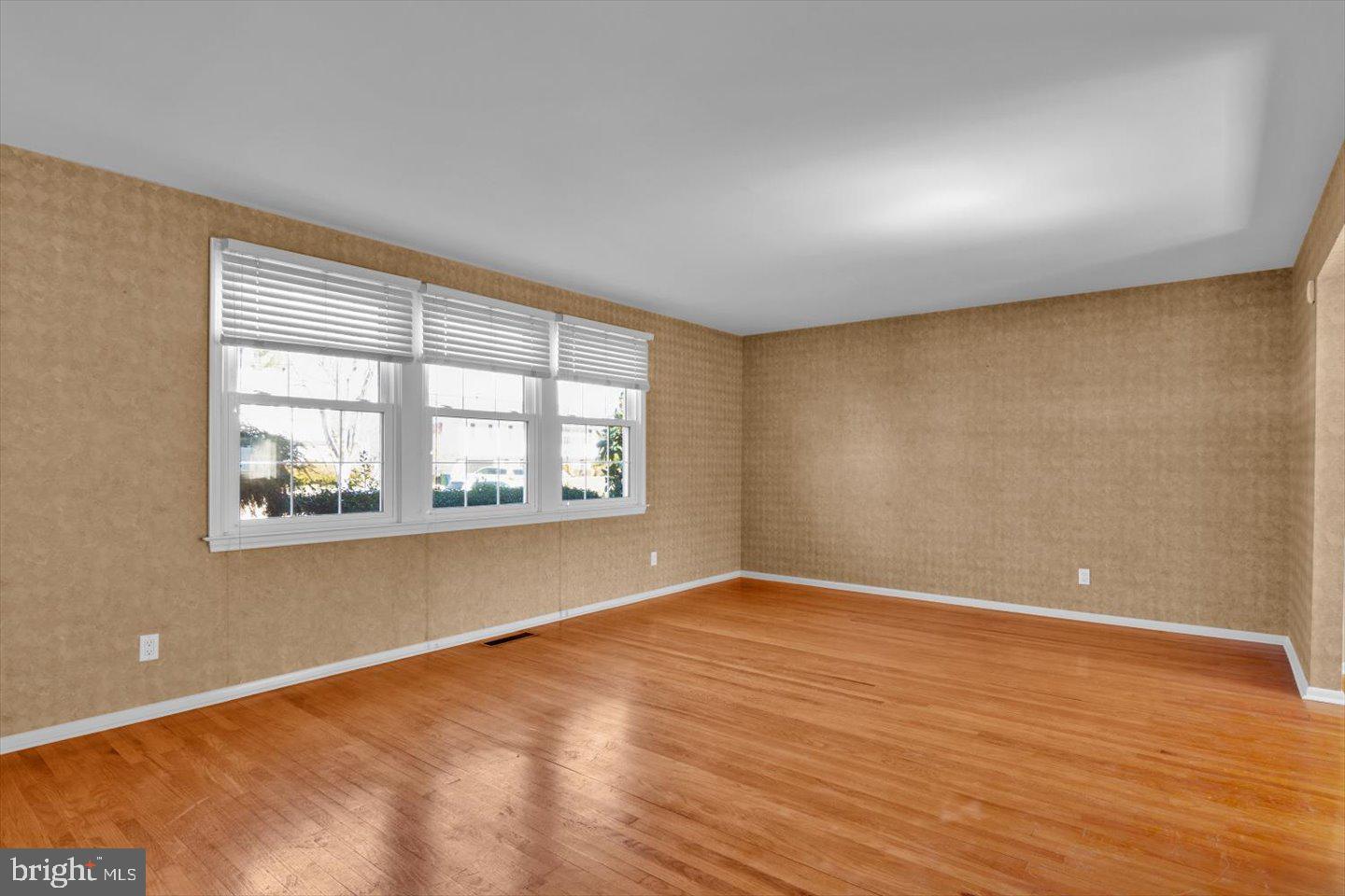 104 Lamp Post Lane Cherry Hill, NJ 08003 - Photo 8 of 44 an empty room with wooden floor and windows