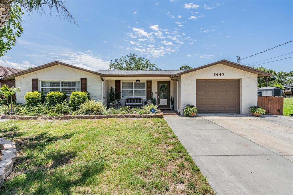 5440 Quist Drive Port Richey, FL 34668 - Photo 1 of 1 a front view of a house with garden