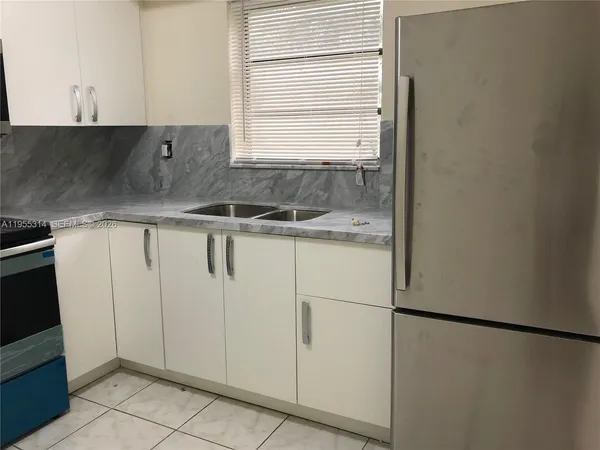 a view of a kitchen with a sink