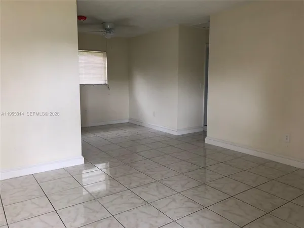 an empty room with a bench