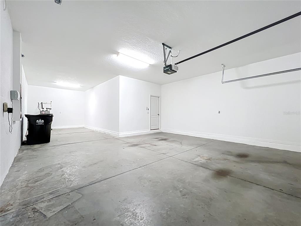 14240 Blue Dasher Drive Riverview, FL 33569 - Photo 24 of 25 a view of a big room with wooden floor and windows