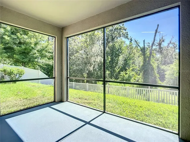 a view of a room with yard from a window