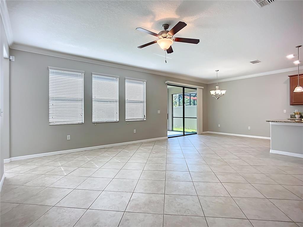 14240 Blue Dasher Drive Riverview, FL 33569 - Photo 3 of 25 a view of an empty room with a window