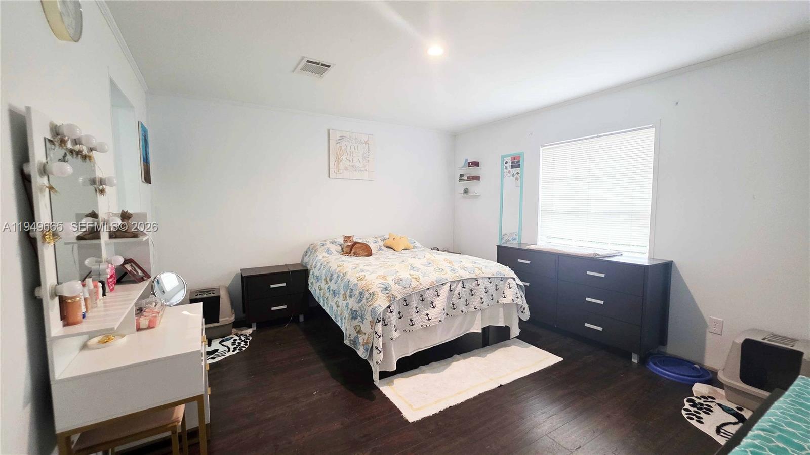 612 Hunting Clb Avenue Clewiston, FL 33440 - Photo 28 of 36 a bedroom with a bed and window